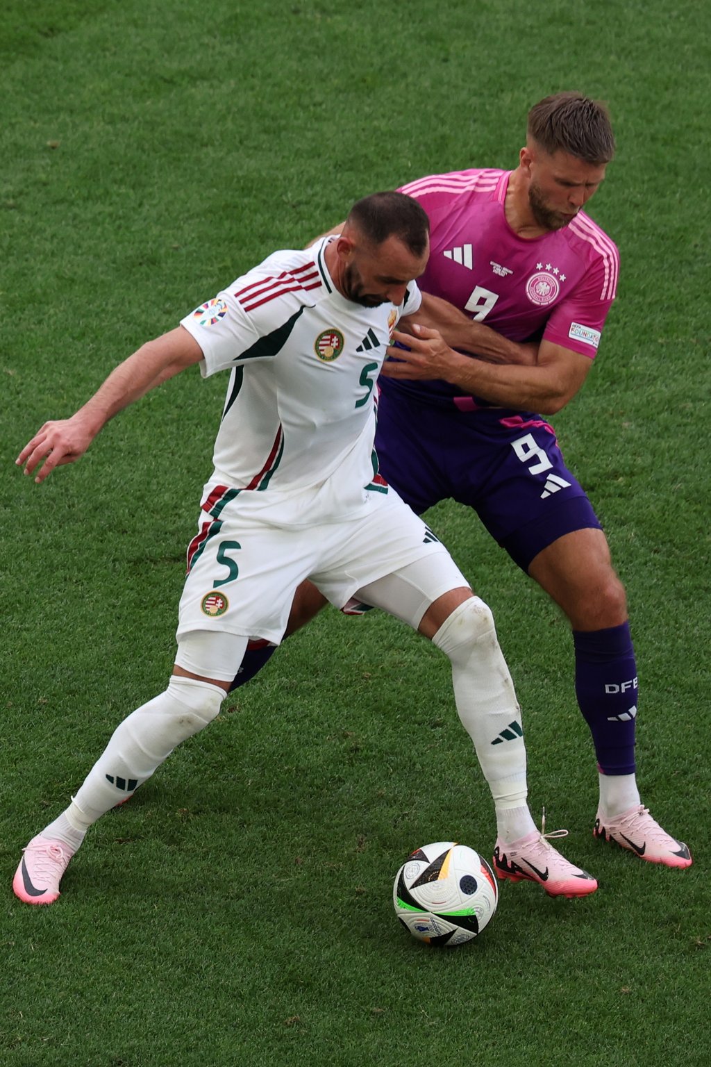 Stuttgart (Germany), 19/06/2024.- Attila Fiola of Hungary (L) in action against Niclas Fuellkrug of Germany during the UEFA EURO 2024 Group A soccer match between Germany and Hungary, in Stuttgart, Germany, 19 June 2024. (Alemania, Hungría) EFE/EPA/MOHAMED MESSARA
