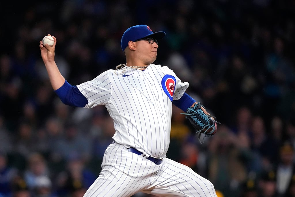 El mexicano Javier Assad permitió una carrera en cinco innings, en la paliza 14-1 sobre los Rockies. (AP)
