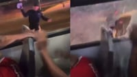 Imagen VIDEO: Policía lanza piedra a camión con aficionados de Chivas tras trifulca; hay 97 detenidos