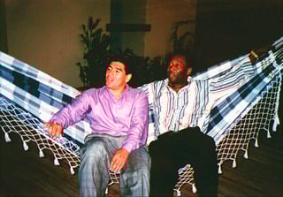 FILE - Argentine soccer star Diego Armando Maradona, left, rests in a hammock with Brazilian soccer star Pele, during a meeting in Rio de Janeiro, Brazil, May 13, 1995. Pelé, the Brazilian king of soccer who won a record three World Cups and became one of the most commanding sports figures of the last century, died in Sao Paulo on Thursday, Dec. 29, 2022. He was 82. (AP Photo/G. Copolla, File)