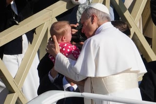 Pope Leo XIV caresses a baby on his popemobile as he tours St. Peter's Square at the Vatican prior to the inaugural Mass of his pontificate, Sunday, May 18, 2025. (AP Photo/Domenico Stinellis) Pope Leo XIV caresses a baby on his popemobile as he tours St. Peter's Square at the Vatican prior to the inaugural Mass of his pontificate, Sunday, May 18, 2025. (AP Photo/Domenico Stinellis)