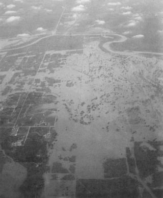 This photo provided by the Fort Bend County Emergency Management Office via NOAA shows flooding from the Brazos River between December 1991 to January 1992. (Mel Speed/Fort Bend County Emergency Management Office via AP) This photo provided by the Fort Bend County Emergency Management Office via NOAA shows flooding from the Brazos River between December 1991 to January 1992. (Mel Speed/Fort Bend County Emergency Management Office via AP)