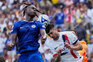 Chelsea's Trevoh Chalobah, left, and Paris Saint-Germain's Lucas Beraldo jump for the ball during the Club World Cup final soccer match between Chelsea and PSG in East Rutherford, N.J., Sunday, July 13, 2025. (AP Photo/Chris Szagola)