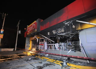 Ataque. Fotografía del 19 de enero, que muestra la fachada de una tienda de la cadena Oxxo, que fue atacada por un grupo armado en el municipio de Tizayuca, en el estado mexicano de Hidalgo. (EFE)