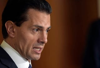 'Me parece una calumnia y de las calumnias e infamias quedan manchas', respondió Peña Nieto al caso del 'depa rosa'. (ARCHIVO) 