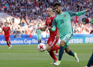 Fue un partido muy parejo entre los locales y Portugal. (AP)
