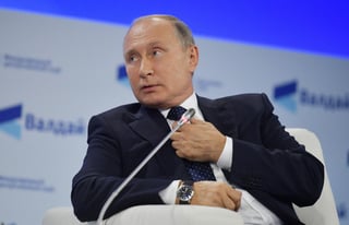 Tragedia. Putin culpó ayer a la globalización de la muerte de estudiantes en Crimea. (EFE)