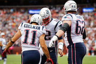 La ofensiva de los Patriotas, comandada por Tom Brady (c), es la segunda más anotadora en esta temporada. (AP) 