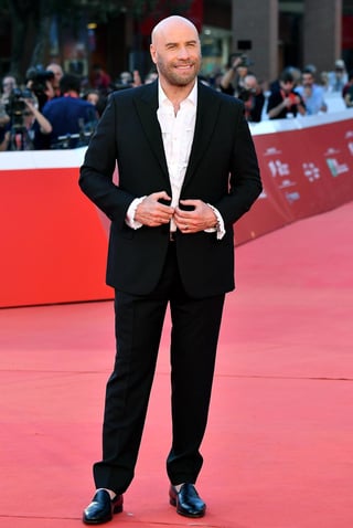 Feliz de su carrera. El actor John Travolta recibe el premio de Roma 'orgulloso' de ser un icono atemporal. (EFE)