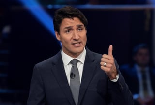 El primer ministro canadiense, Justin Trudeau, anunció que no se permitirá la entrada en Canadá a aquellos nacionales que tengan síntomas de la enfermedad. (ARCHIVO)