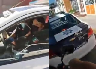 Vecinos de Coacalco, persiguieron una patrulla de policía después de que acusaran a los oficiales de 'robarle' el celular al operador de un camión de carga (CAPTURA) 