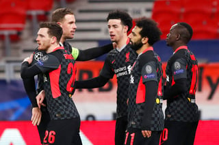 El Liverpool se impuso este martes por 0-2 al RB Leipzig, con goles de Mo Salah y Sadio Mané, con lo que puso un pie en cuartos de final ya que el equipo alemán necesitaría un 0-3 para lograr la remontada en Anfield Road. (AP)