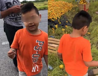 El infante se acercó al conductor del camión accidentado con la finalidad de pegarle por la naranja que transportaba (ESPECIAL)  