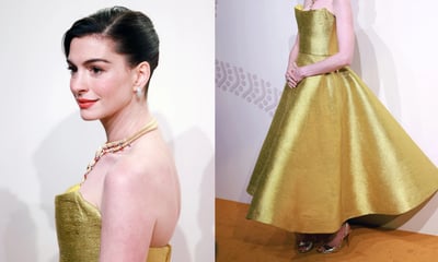 Anne Hathaway luce como princesa con vestido dorado