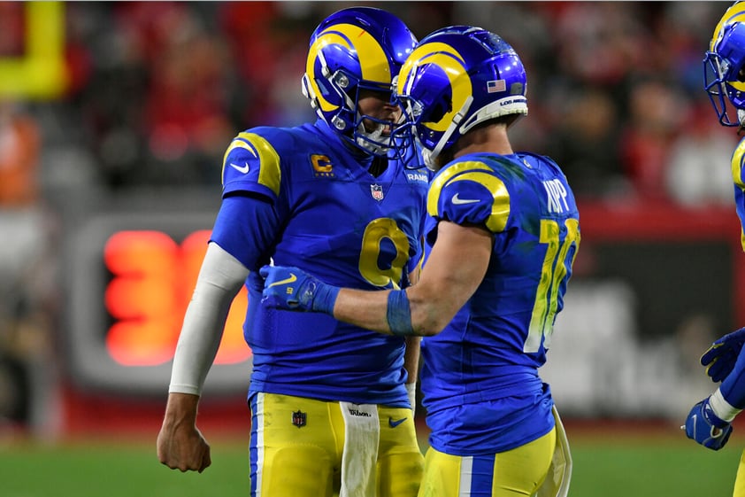 Los Angeles Rams quarterback Matthew Stafford (9) celebrates with wide receiver Cooper Kupp (10) after his reception against the Tampa Bay Buccaneers during the second half of an NFL divisional round playoff football game Sunday, Jan. 23, 2022, in Tampa, Fla. (AP Photo/Jason Behnken)