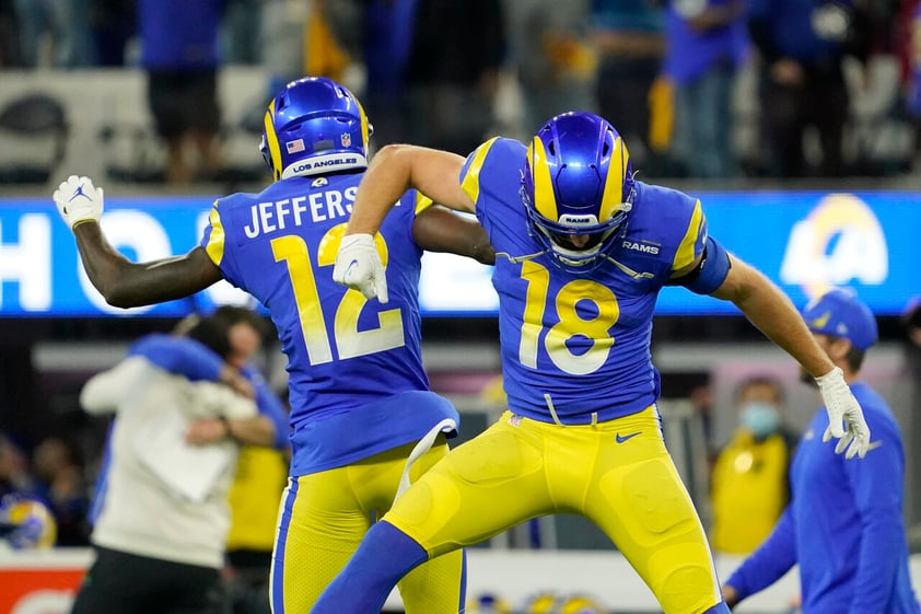 Los Angeles Rams' Van Jefferson, left, and Ben Skowronek celebrate after the NFC Championship NFL football game against the San Francisco 49ers Sunday, Jan. 30, 2022, in Inglewood, Calif. The Rams won 20-17 to advance to the Super Bowl. (AP Photo/Elaine Thompson)