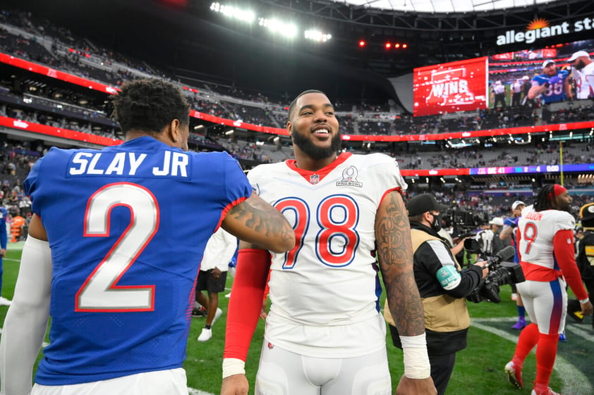 NFC cornerback Darius Slay (2), of the Philadelphia Eagles, greets AFC lineman Jeffery Simmons (98), of the Tennessee Titans, after the Pro Bowl NFL football game, Sunday, Feb. 6, 2022, in Las Vegas. (AP Photo/David Becker)