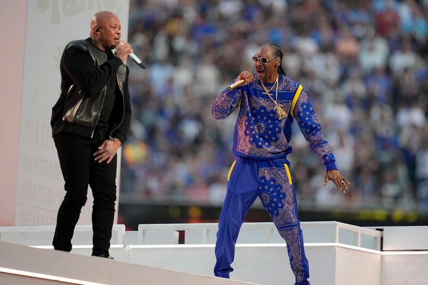 Dr. Dre, left, and Snoop Dogg perform during halftime of the NFL Super Bowl 56 football game between the Los Angeles Rams and the Cincinnati Bengals Sunday, Feb. 13, 2022, in Inglewood, Calif. (AP Photo/Marcio Jose Sanchez)