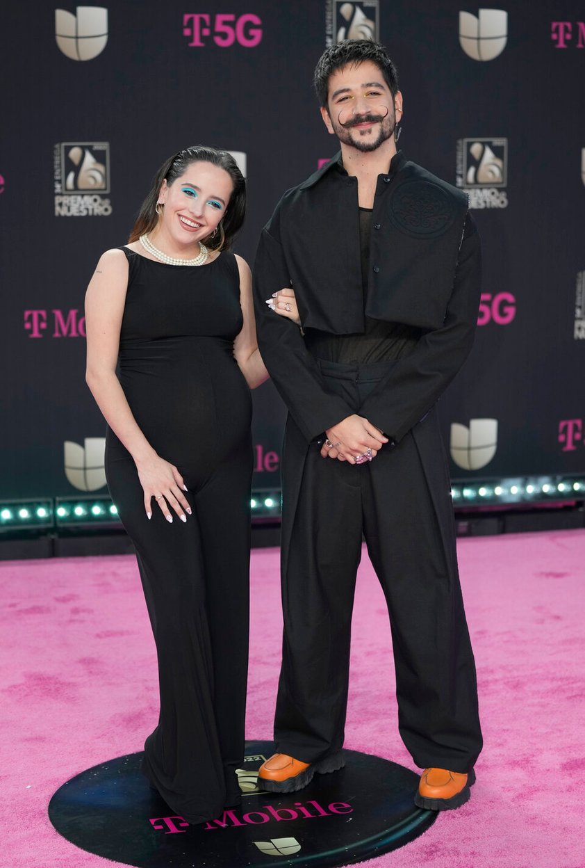 Evaluna Montaner, left, and Camilo arrive at Premio Lo Nuestro at FTX Arena in Miami on Thursday, Feb. 24, 2022. (AP Photo/Rebecca Blackwell)