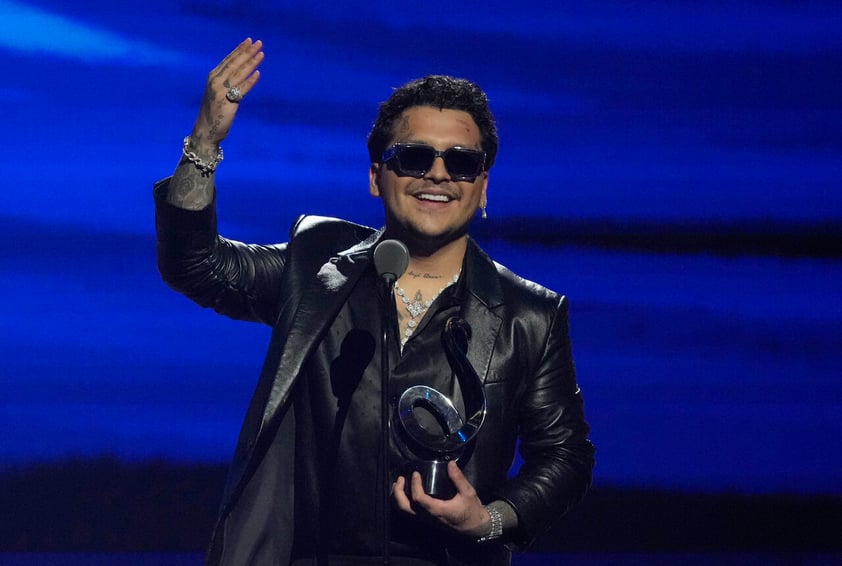 Christian Nodal acepta el premio por artista regional mexicano del año en el Premio Lo Nuestro en la FTX Arena en Miami el jueves 24 de febrero, 2022.