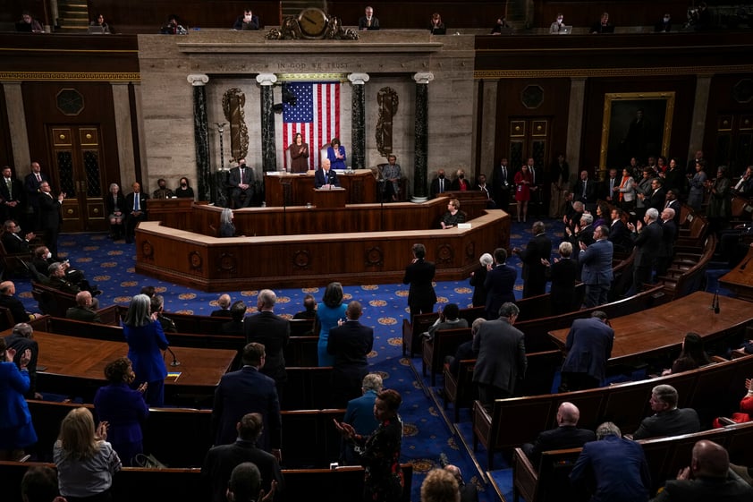 NYTSOTU2022 - President Joe Biden delivers his state of the union address to Congress in the Capitol on Tuesday March 1, 2022 in Washington, D.C. Seated behind him are Vice President Kamala Harris, left, and Speaker Nancy Pelosi. (Photograph by Sarahbeth Maney/The New York Times)