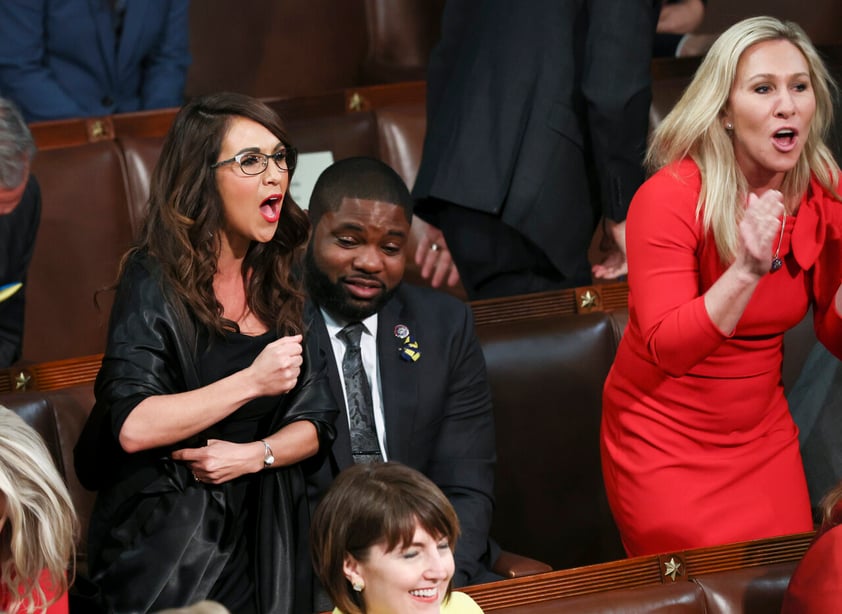 U.S. Rep. Lauren Boebert (R-CO) and Rep. Marjorie Taylor Greene (R-GA) scream 'Build the Wall' at President Joe Biden with Rep. Byron Donalds (R-FL) between them during Biden's State of the Union address to a joint session of the U.S. Congress in the House of Representatives Chamber at the Capitol in Washington, U.S. March 1, 2022.  REUTERS/Evelyn Hockstein/Pool