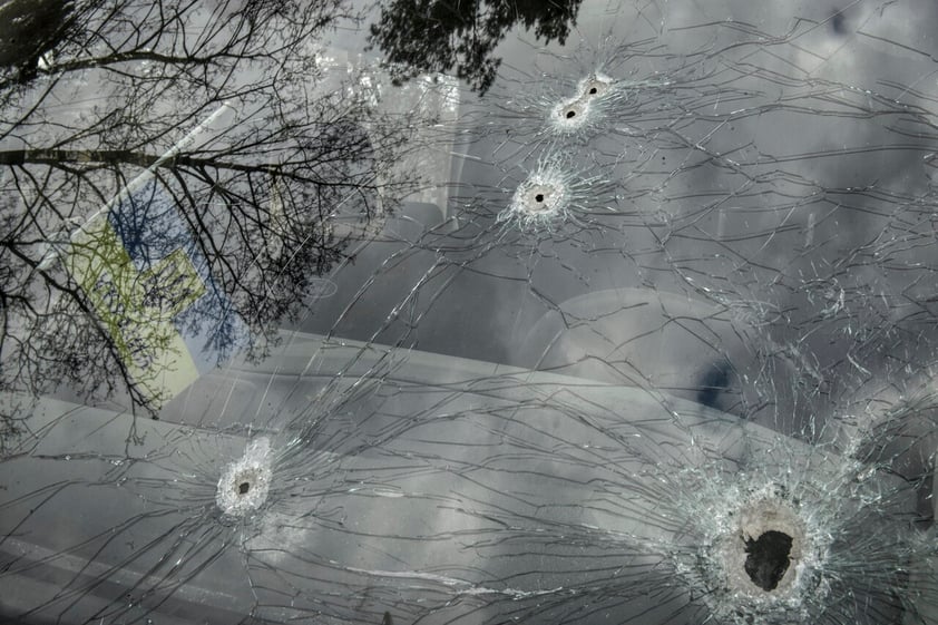 Kyiv (Ukraine), 04/04/2022.- Bullet holes on a screen of shelled car in Bucha city, which was the recaptured by the Ukrainian army, Kyiv (Kiev) area, Ukraine, 04 April 2022. More than 410 bodies of killed civilians were carried from the recaptured territory in Kyiv's area for exgumation and expert examination. The UN Human Rights Council has decided to launch an investigation into the violations committed after Russia's full-scale invasion of Ukraine as Ukrainian Parliament reported. On 24 February, Russian troops had entered Ukrainian territory in what the Russian president declared a 'special military operation', resulting in fighting and destruction in the country, a huge flow of refugees, and multiple sanctions against Russia. (Rusia, Ucrania) EFE/EPA/OLEG PETRASYUK ATTENTION: GRAPHIC CONTENT