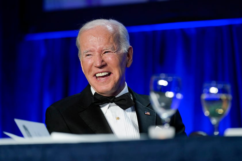 President Joe Biden laughs as he listens to Trevor Noah, host of Comedy Central’s “The Daily Show,” speak at the annual White House Correspondents' Association dinner, Saturday, April 30, 2022, in Washington. (AP Photo/Patrick Semansky)