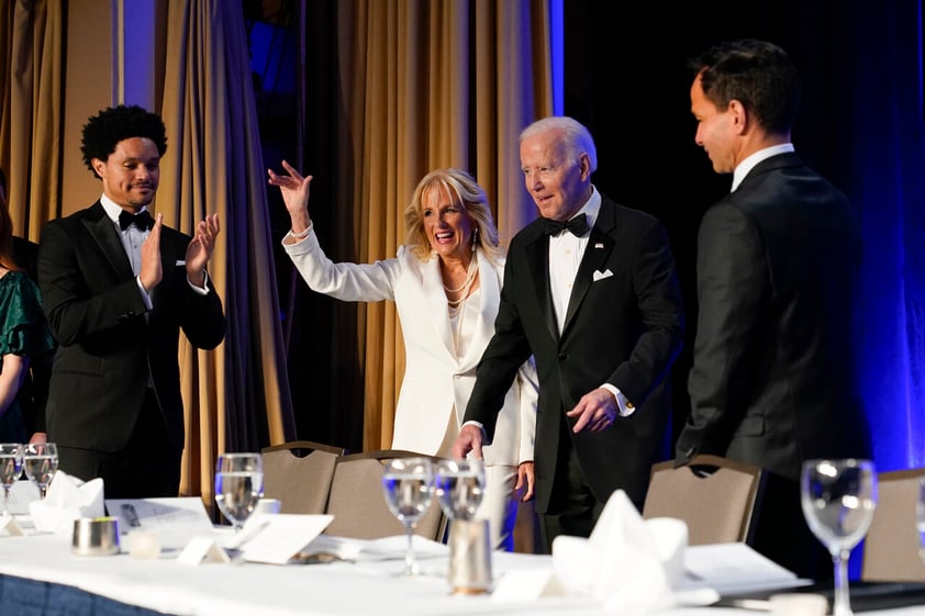 President Joe Biden and first lady Jill Biden arrive at the annual White House Correspondents' Association dinner, Saturday, April 30, 2022, in Washington. At left is comedian Trevor Noah. (AP Photo/Patrick Semansky)