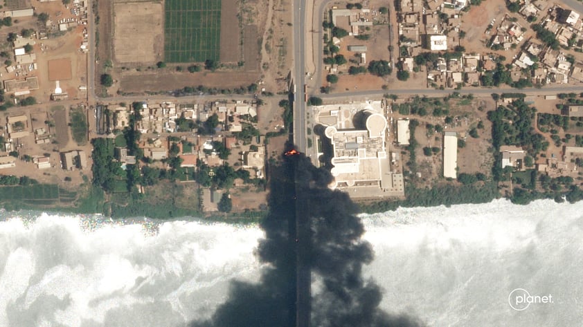 This satellite photo by Planet Labs PBC shows fires burning near a hospital in Khartoum, Sudan, Sunday April 16, 2023. The Sudanese military and a powerful paramilitary group are battling for control of the chaos-stricken nation for a second day.  (Planet Labs PBC via AP)