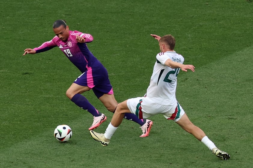 Stuttgart (Germany), 19/06/2024.- Leroy Sane of Germany (L) in action against Marton Dardai of Hungary during the UEFA EURO 2024 Group A soccer match between Germany and Hungary, in Stuttgart, Germany, 19 June 2024. (Alemania, Hungría) EFE/EPA/MOHAMED MESSARA