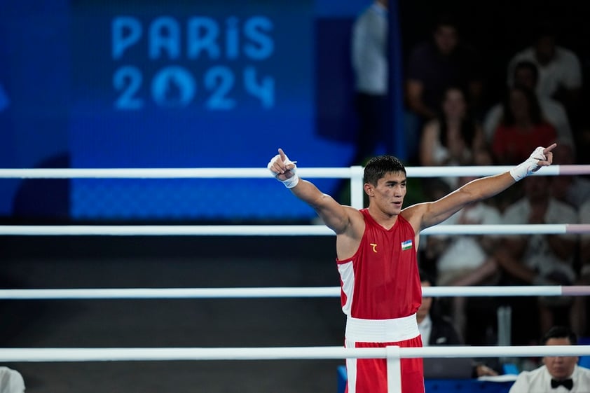 Uzbekistan's Asadkhuja Muydinkhujaev celebrates after defeating Mexico's Marco Verde in their men's 71 kg final boxing match at the 2024 Summer Olympics, Friday, Aug. 9, 2024, in Paris, France. (AP Photo/John Locher)