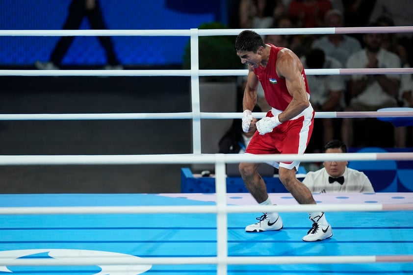 Uzbekistan's Asadkhuja Muydinkhujaev celebrates after defeating Mexico's Marco Verde in their men's 71 kg final boxing match at the 2024 Summer Olympics, Friday, Aug. 9, 2024, in Paris, France. (AP Photo/John Locher)