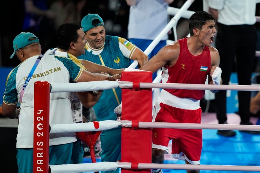 Uzbekistan's Asadkhuja Muydinkhujaev celebrates after defeating Mexico's Marco Verde in their men's 71 kg final boxing match at the 2024 Summer Olympics, Friday, Aug. 9, 2024, in Paris, France. (AP Photo/John Locher)