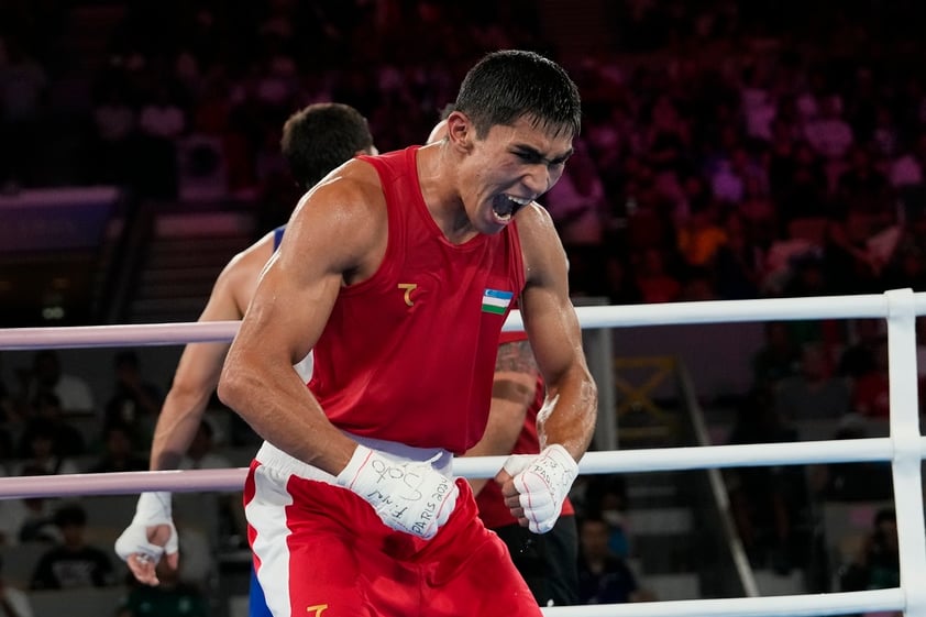 Uzbekistan's Asadkhuja Muydinkhujaev celebrates after defeating Mexico's Marco Verde in their men's 71 kg final boxing match at the 2024 Summer Olympics, Friday, Aug. 9, 2024, in Paris, France. (AP Photo/Ariana Cubillos)