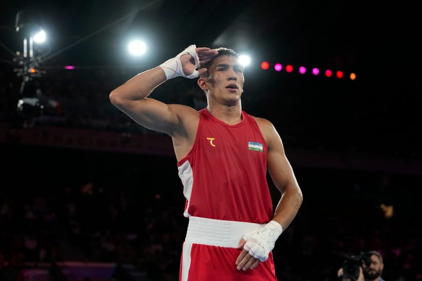 Uzbekistan's Asadkhuja Muydinkhujaev gestures after defeating Mexico's Marco Verde in their men's 71 kg final boxing match at the 2024 Summer Olympics, Friday, Aug. 9, 2024, in Paris, France. (AP Photo/Ariana Cubillos)