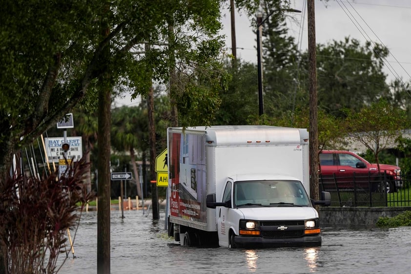 High water is seen near Hillsborough street in the aftermath of hurricane Milton, Thursday, Oct. 10, 2024, in Tampa, Fla. (AP Photo/Mike Stewart)