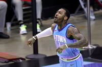 John Wall contribuyó con 24 puntos para el triunfo de Rockets. (AP)