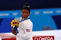 Simone Biles no previó que su segunda participación en los Juegos Olímpicos se convertiría en un hito que abriría la conversación sobre las medidas necesarias para cuidar la salud mental en todos los niveles del deporte. (ARCHIVO) 
 