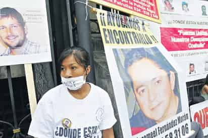 Protestas. Una mujer participa en la protesta en la Secretaría de Gobernación en Ciudad de México, el día de ayer.