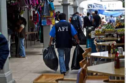 ¿AFI?. En Querétaro, una veintena de policías federales, portaba uniformes caducos. (AGENCIA REFORMA)