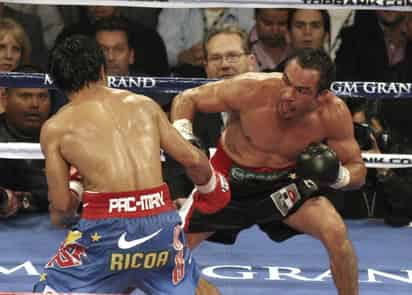 PRI. Juan Manuel Márquez (d), en su tercera pelea contra el filipino Manny Paquiao, el 12 de noviembre de 2011, donde usó el logo del PRI.