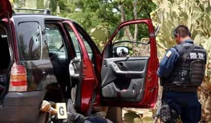 Crimen. Los cuerpos se encontraban dentro de tres camionetas abandonadas.
