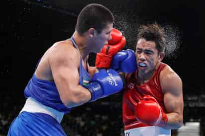 El uzbeko Bektimir Belikuziev fue superior al mexicano Misael Espinoza en batalla por el pase a la final en el peso medio. (EFE)