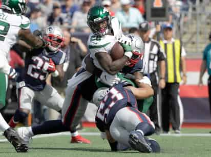 La defensiva de los 'Pats' no ha permitido un touchdown por tierra o aire en lo que va de la campaña, un récord en la era del Super Bowl. (AP) 