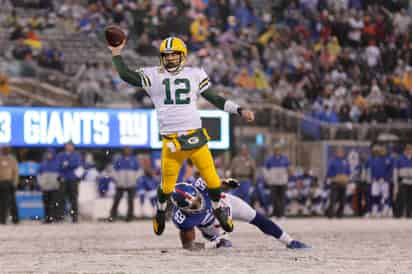 En la 'Gran Manzana', Rodgers completó 21 pases para 243 yardas y cuatro anotaciones. (AP)