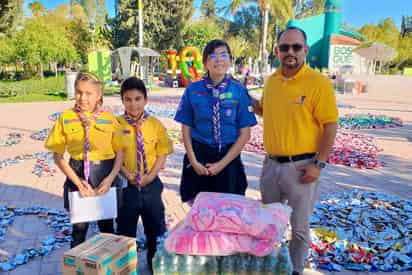 Jóvenes de un grupo boyscout lograron reunir tapas y latas. (GUADALUPE MIRANDA)