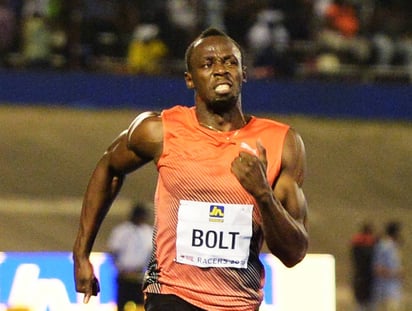 El jamaicano Usain Bolt toma el relevo hoy cuando se presente por primera vez en la moderna pista azul del estadio Enganhao, Brasil. (Archivo)