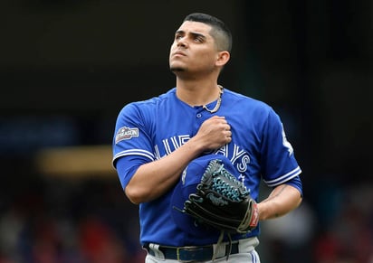 Roberto Osuna no permitió carreras  en una entrada y dos tercios para lograr el rescate en el segundo triunfo de Toronto. (AP)