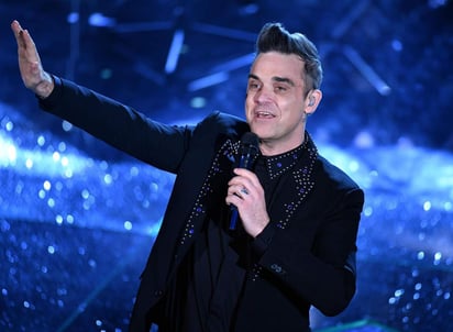 El cantante británico Robbie Williams, exintegrante del grupo Take That e intérprete de temas como Rock DJ y Feel, festeja este lunes 43 años de vida. (ARCHIVO)